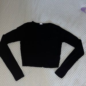 Black Garage brand long sleeve shirt with key hole on upper left shoulder.Size S